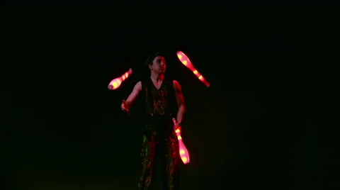Juggler showing tricks with light balls in the whole dark Stock Footage 63340459