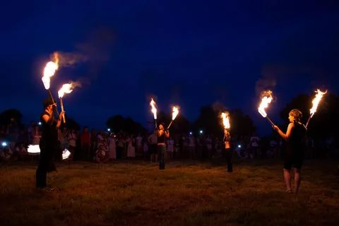Juggling burning torches Stock Photos