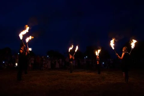 Juggling burning torches Stock Photos