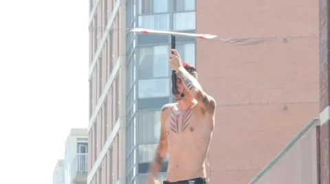 Juggling knives outdoor street performer Stock Footage