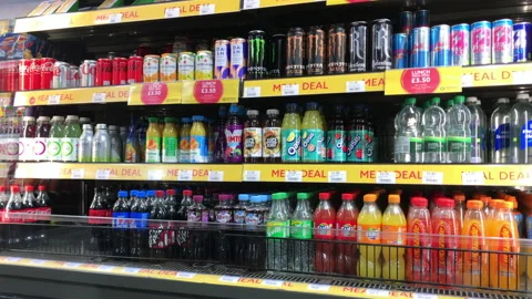 Juice and carbonated drinks in a store shelf Stock Footage 174367659