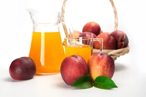 Juice and fresh peaches  on white background Stock Photos