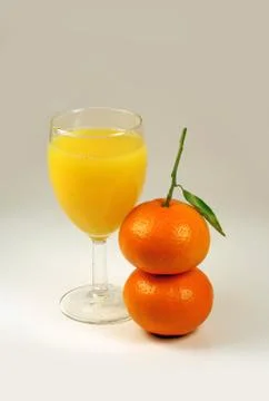 Juice and two mandarin Stock-Fotos
