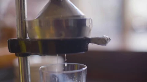 Juice being extracted from the juicer Stock Footage 87806460