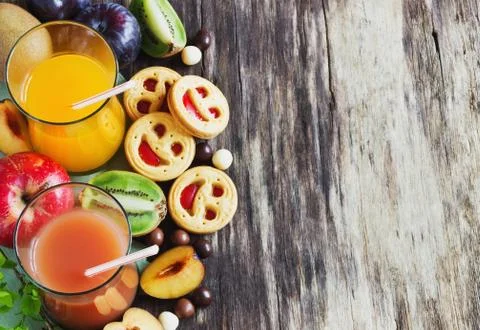 Juice, biscuits and fruit Stock Photos