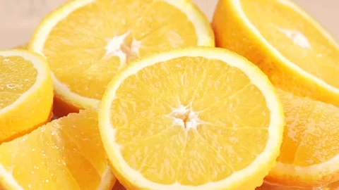 Juice drops pouring on orange slices, macro, slow motion. Stock Footage 297744848