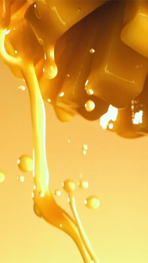 The juice flows through the sliced mango fruit. Filmed on a high-speed camera at 스톡 동영상 335303315