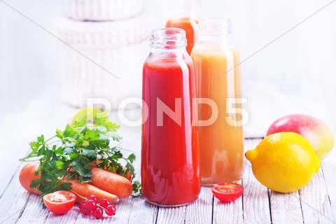 Juice from fruits and vegetables in bottle Stock Photos