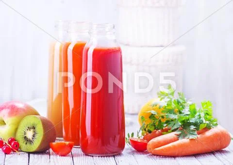 Juice from fruits and vegetables in bottle Stock Photos