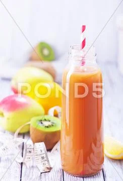 Juice from fruits and vegetables in bottle Stock Photos