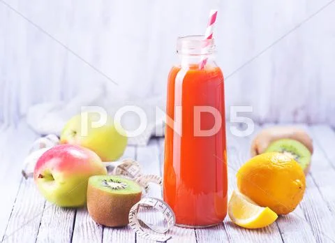 Juice from fruits and vegetables in bottle Stock Photos