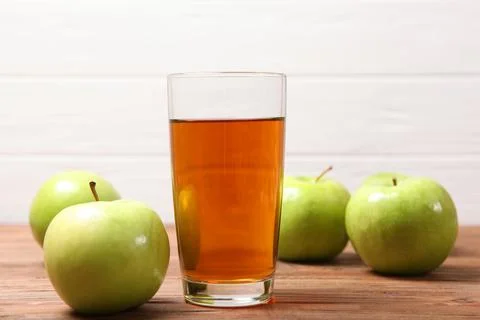 Juice from green apples on the table. Photos