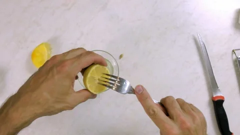 Juice lemon with assistance of fork. Making Lemon Mascarpone Pie Series. Stock Footage 98798866