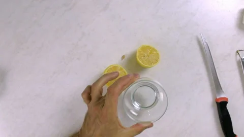 Juice lemon with assistance of fork. Making Lemon Mascarpone Pie Series. Stock Footage 98798872