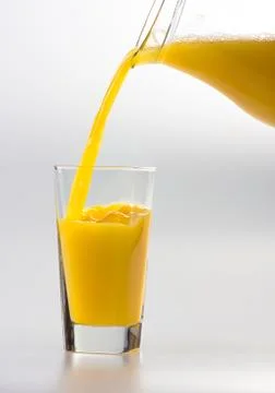 Juice to pour from pitcher Stock Photos