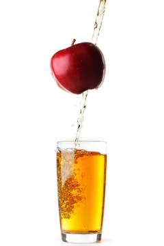 Juice pouring from apple Stock Photos