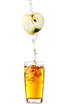 Juice pouring from apple Stock Photos