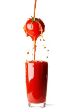 Juice pouring from tomato Stock Photos
