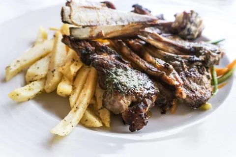 Juice roasted lamb chops on the table Foto stock