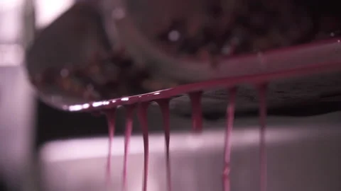 Juice running from press close up. Wine making of crushed grapes pomace and must Stock Footage 153813291