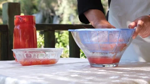 Juice is squeezed from gilaburu fruit (Turkish local fruit) 2 Stock Footage 293998440