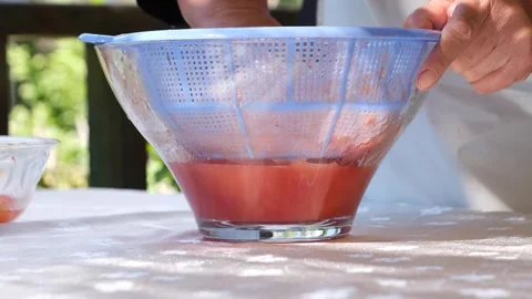 Juice is squeezed from gilaburu fruit (Turkish local fruit) 3 Stock Footage 293998472