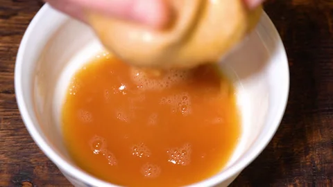 Juice is squeezed out of raw potatoes Stock Footage 252605061