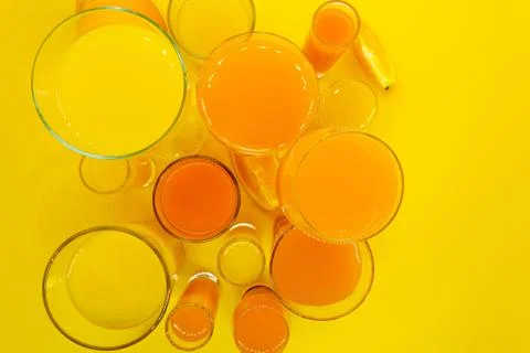 Juice in various shape glasses Stock Photos