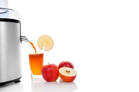 Juicing fresh apples. Stock Photos