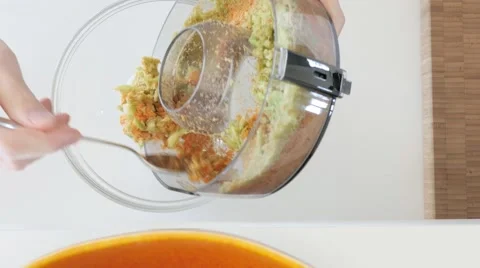 Juicing: fruit and vegetable pulp from machine. UHDTV 4K Stock Footage 46806267