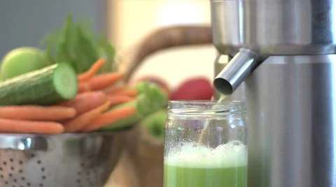 Juicing juicer vegetables closeup Stock Footage 43444479