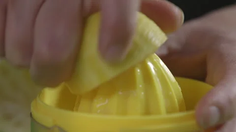 Juicing a lemon; close-up Stock Footage 64014436