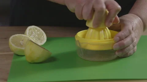 Juicing a lemon Stock Footage 64013427