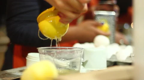 Juicing a Lemon with a Handheld Squeezer Stock Footage 46783586
