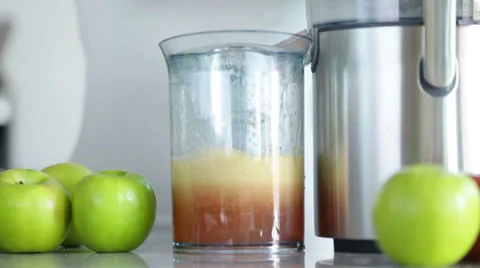 Juicing machine making broccoli vegetable juice Stock Footage 35224200