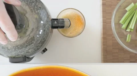 Juicing: Using juicer machine. UHDTV 4K Stock Footage 46785960