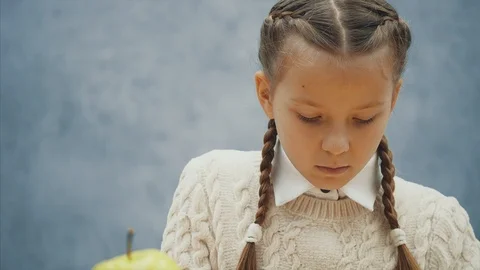 Juicy apple is the best snack for tired from learning pretty kids. Stock Footage 113072453