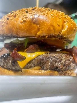 Juicy bacon cheeseburger Stock Photos