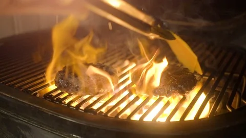 Juicy beef burgers grilled on the barbecue with cheese Stock Footage 111951453