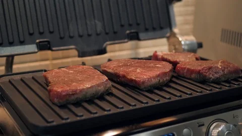 Juicy beef steak overturned with grilled tongs Stock Footage 120148452