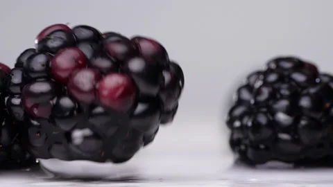 Juicy blackberries falling down. Сlose up. Stock Footage 143612885