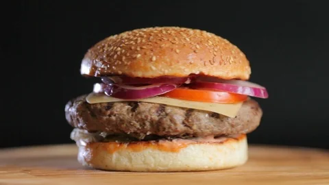 Juicy burger with a big cutlet Stock Footage 104149604
