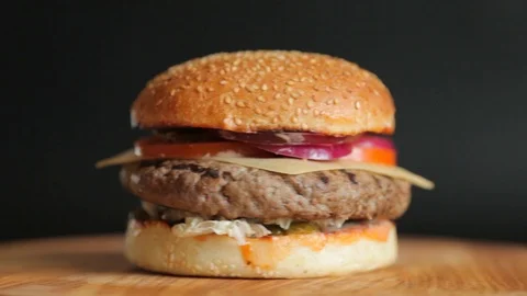 Juicy burger with a big cutlet Stock Footage 104149614