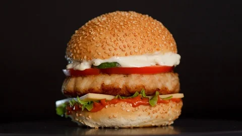 Juicy burger with a big cutlet Stock Footage 104208018
