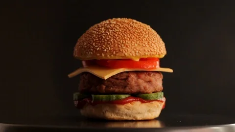 Juicy burger with a big cutlet Stock Footage 104208384