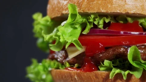 Juicy Burger spin closeup Stock Footage 76887449