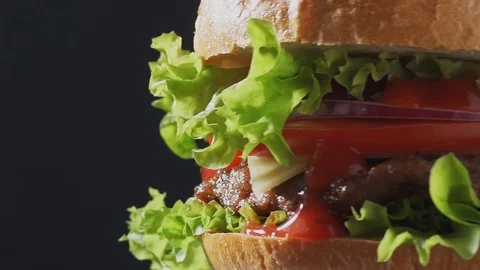 Juicy Burger spin closeup Stock Footage 76897082