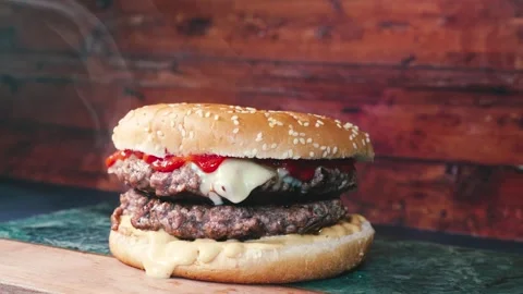Juicy Cheese Burger with BBQ Sauce Stock Footage 327815744