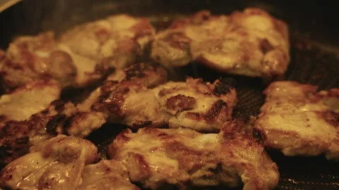 Juicy Chicken Frying in Pan Stock Footage 321428958