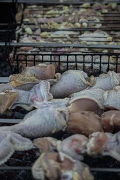 Juicy chicken legs are cooked on coals Stock Photos